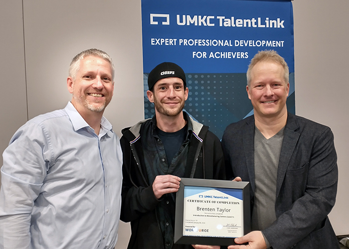 UMKC TalentLink Executive Director Jake Akehurst and WorkForge CEO Nathan Walts presented veteran Brenten Taylor with a certificate of completion at the recent Greater Kansas City Veterans Career Fair.